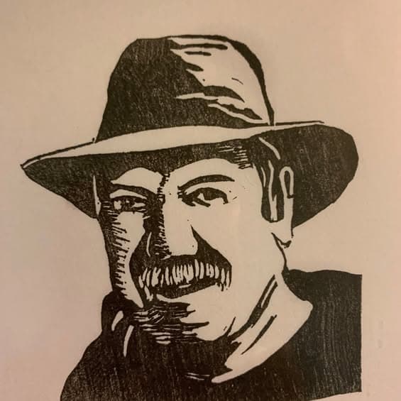 A stamp John cut of his own face